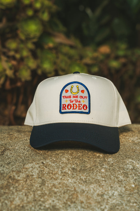 Take Me Out To The Rodeo (Navy/Natural Trucker Cap)